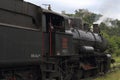 Old steam locomotive and background historic scenery